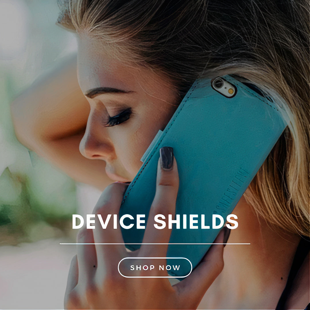 A lady holding a emf protection phone case next to her ear