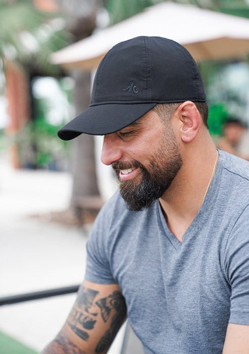 EMF Cap worn at the beach by man