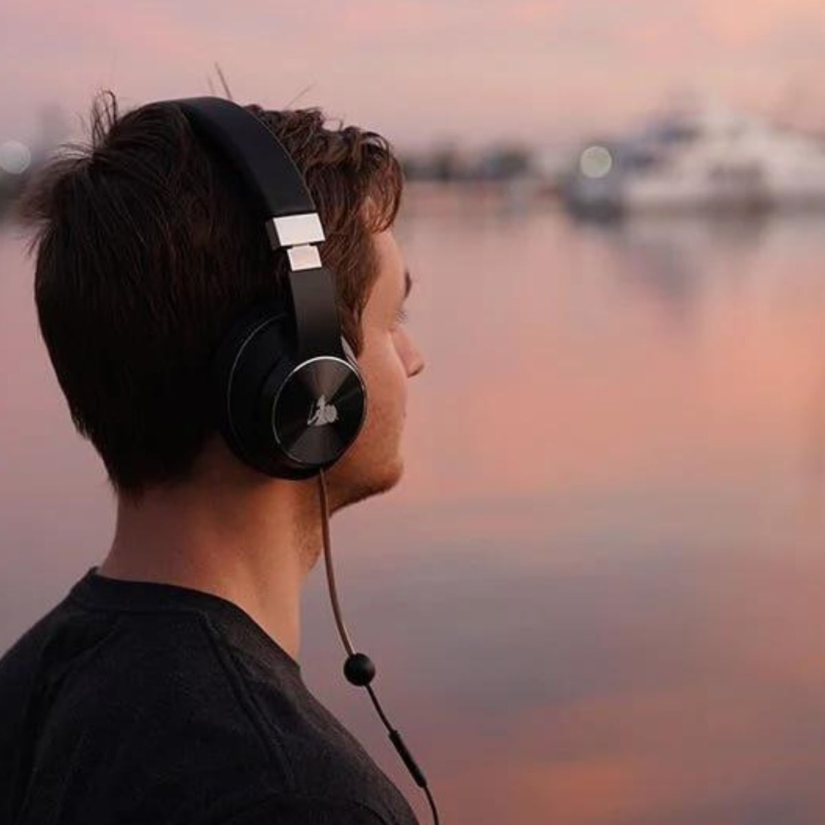 Man listening to DefenderShield Headphones