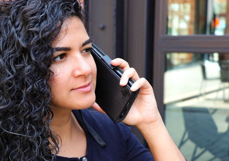 EMF Phone Case being used outside by women