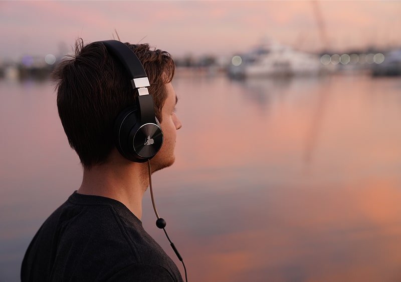 man listening to Defendershield headphones