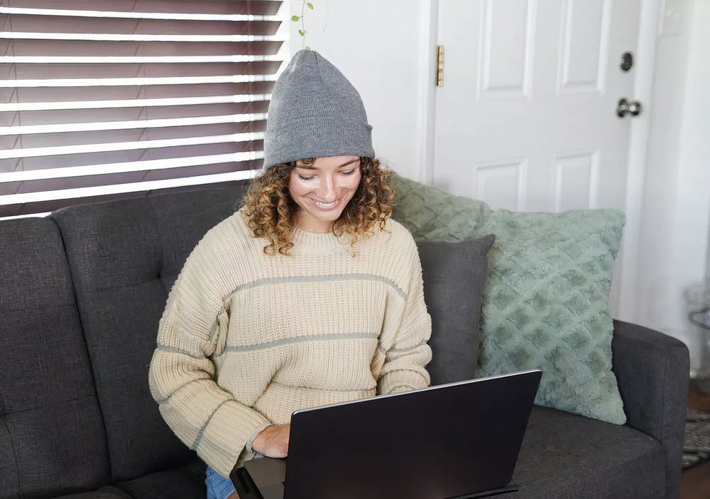 EMF Beanie being used indoors by a women