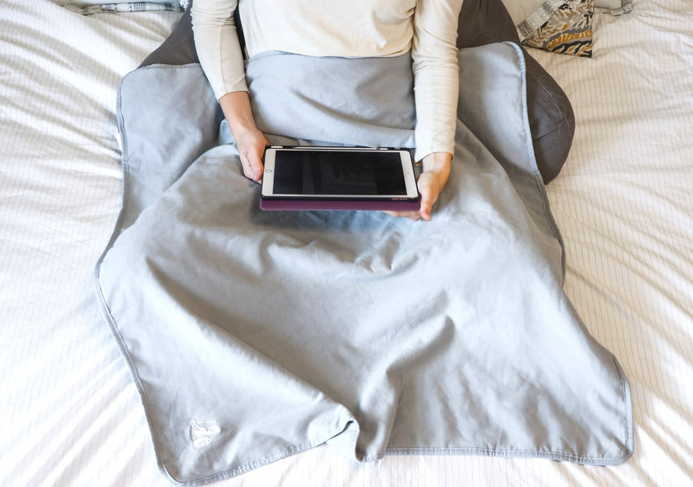 EMF Blanket being used by a girl in bed