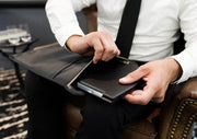Laptop Sleeve being used in professional in a work setting by a man