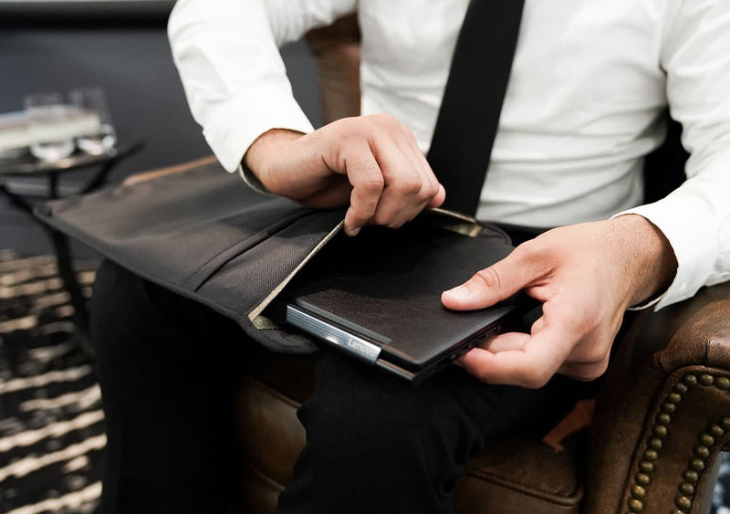 Laptop Sleeve being used in professional in a work setting by a man