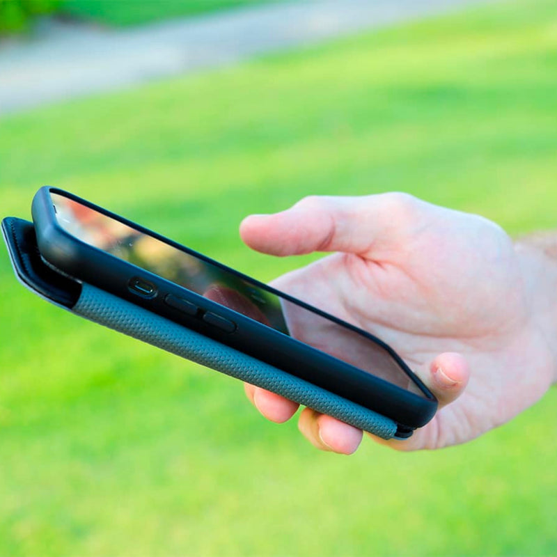 DefenderShield SlimFlip® iPhone 13 Series 5G EMF Phone Case being used in an outdoor setting