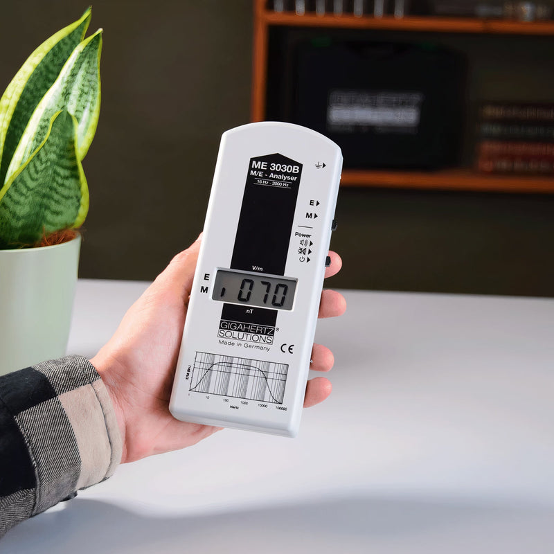 EMF Reader being held at home measuring elf