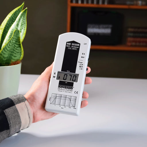 EMF Reader being held at home measuring elf