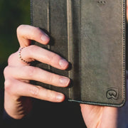EMF Phone Case being used in public taking photos of nature