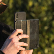 EMF Phone Case being used in public taking photos of nature